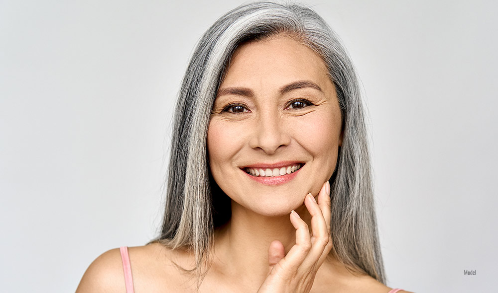 Headshot portrait of middle aged mature woman